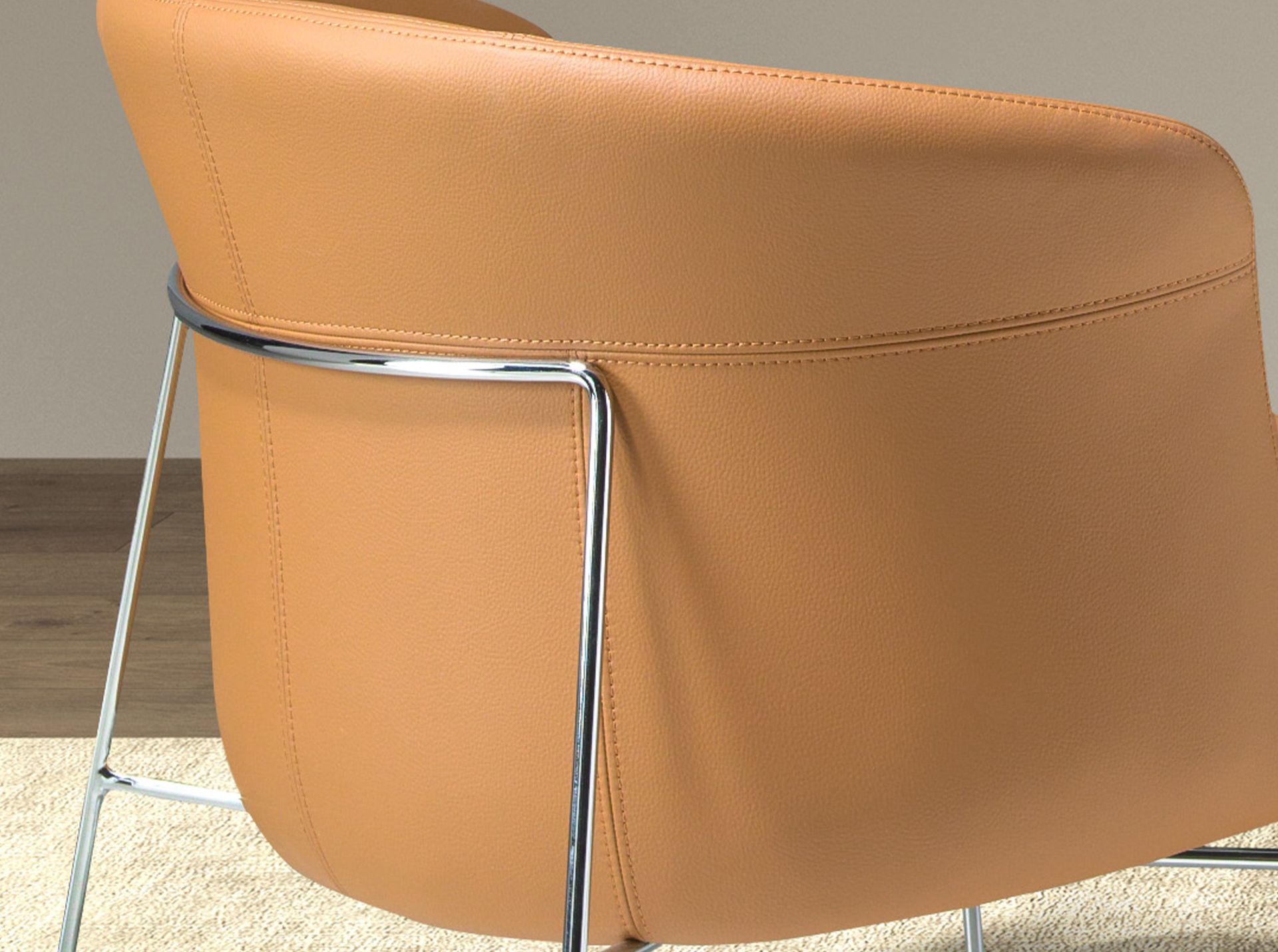 Armchair upholstered in brown leatherette