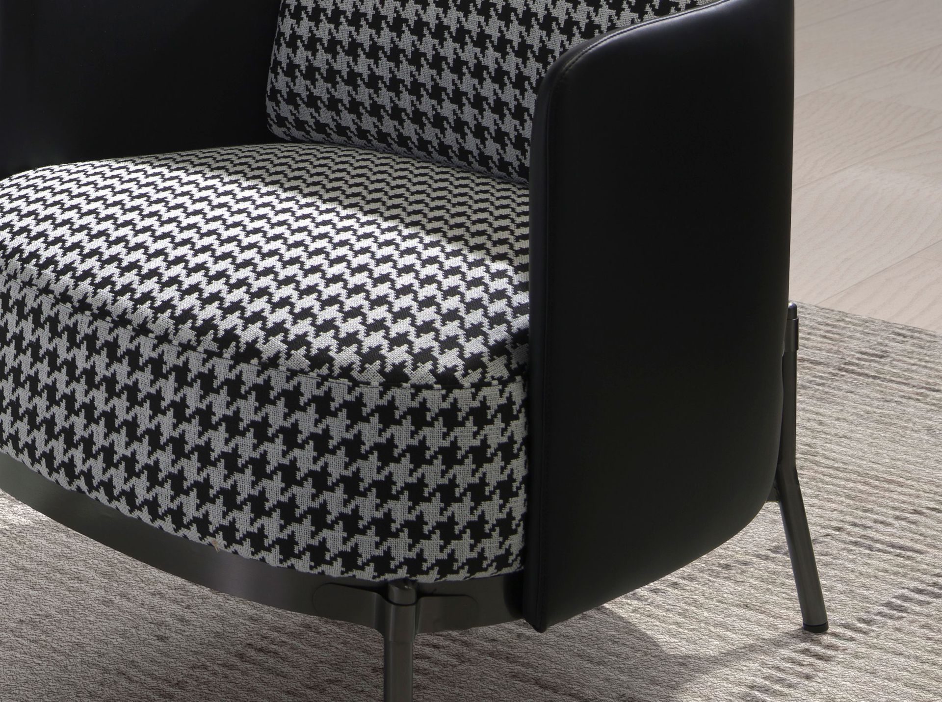 Black and white fabric and black leatherette  armchair