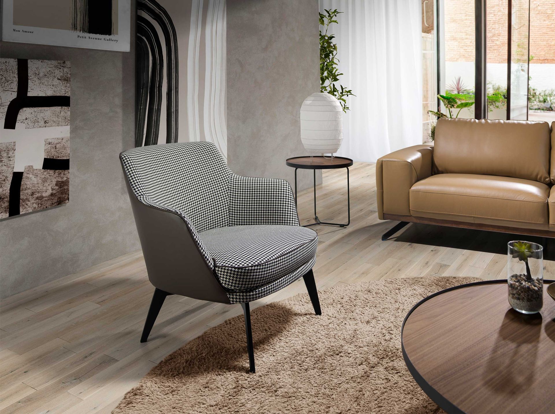 Black and white fabric and chocolate brown leatherette armchair