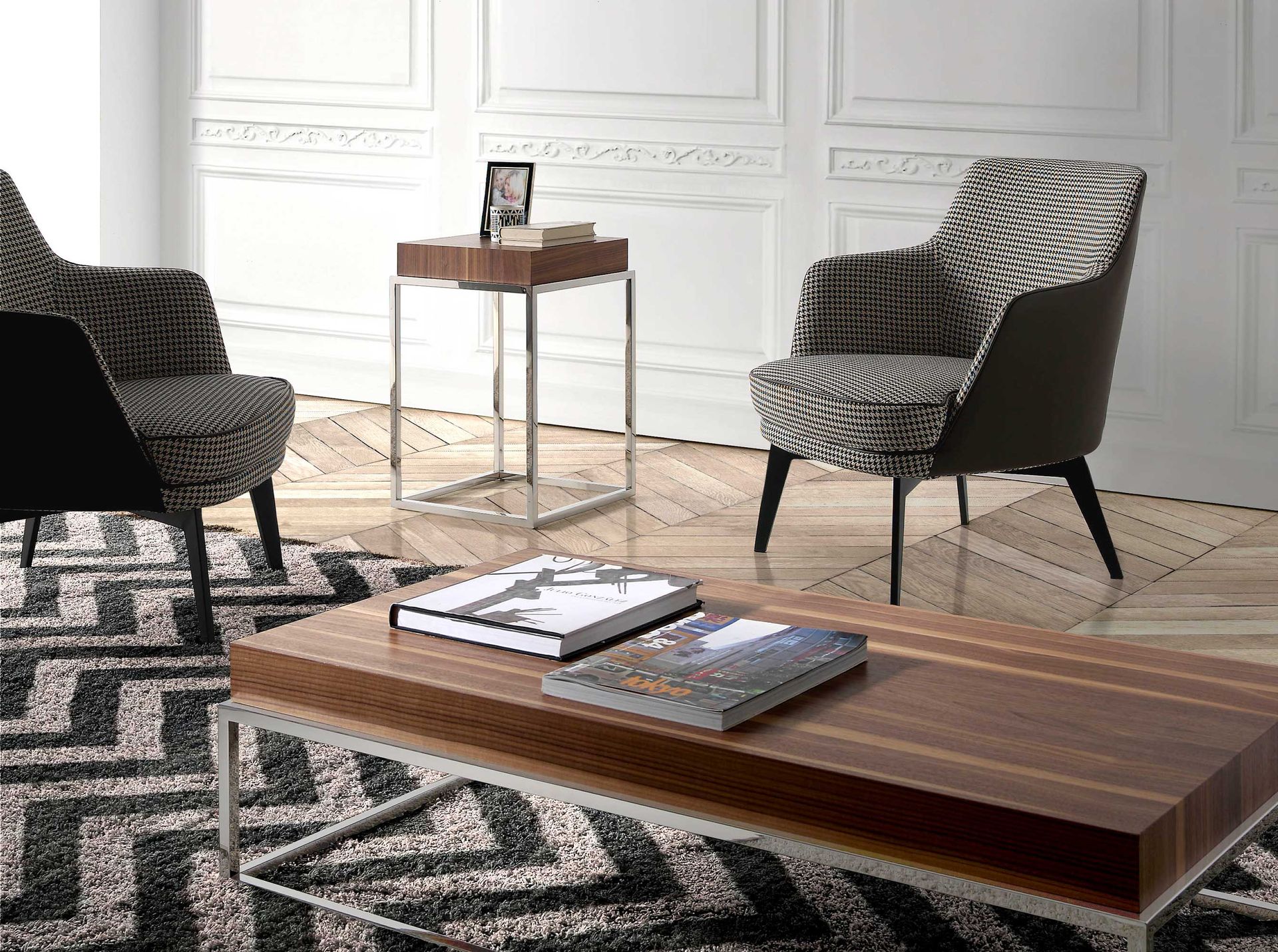 Black and white fabric and chocolate brown leatherette armchair