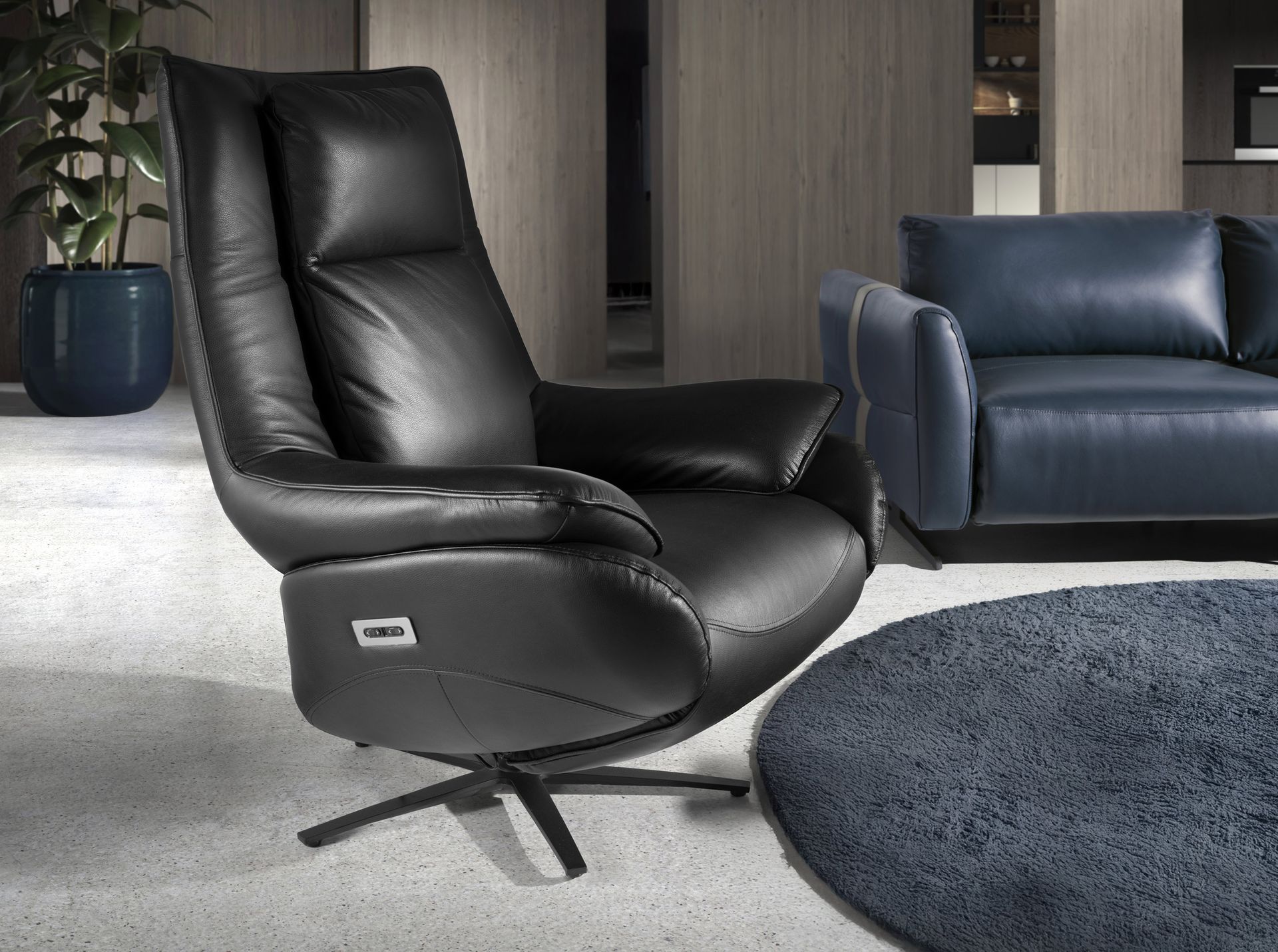 Black leather swivel armchair