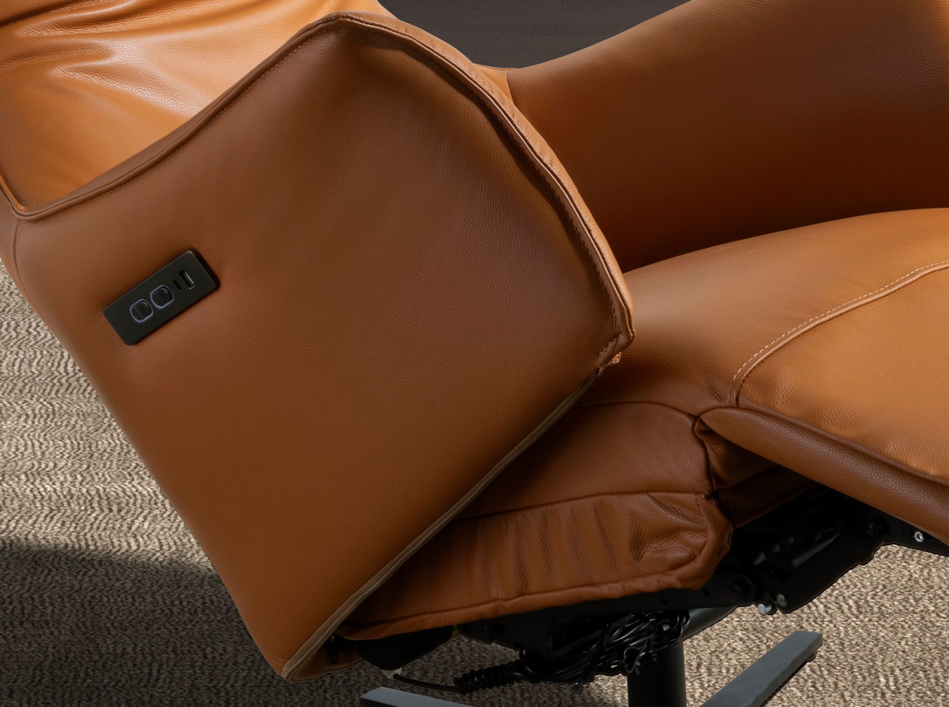 Brown leather swivel armchair