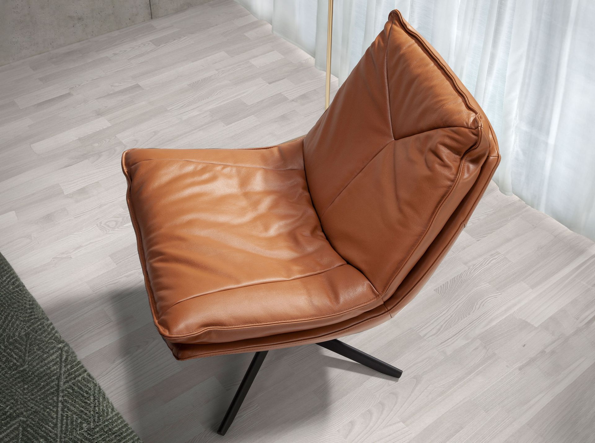 Brown leather swivel armchair