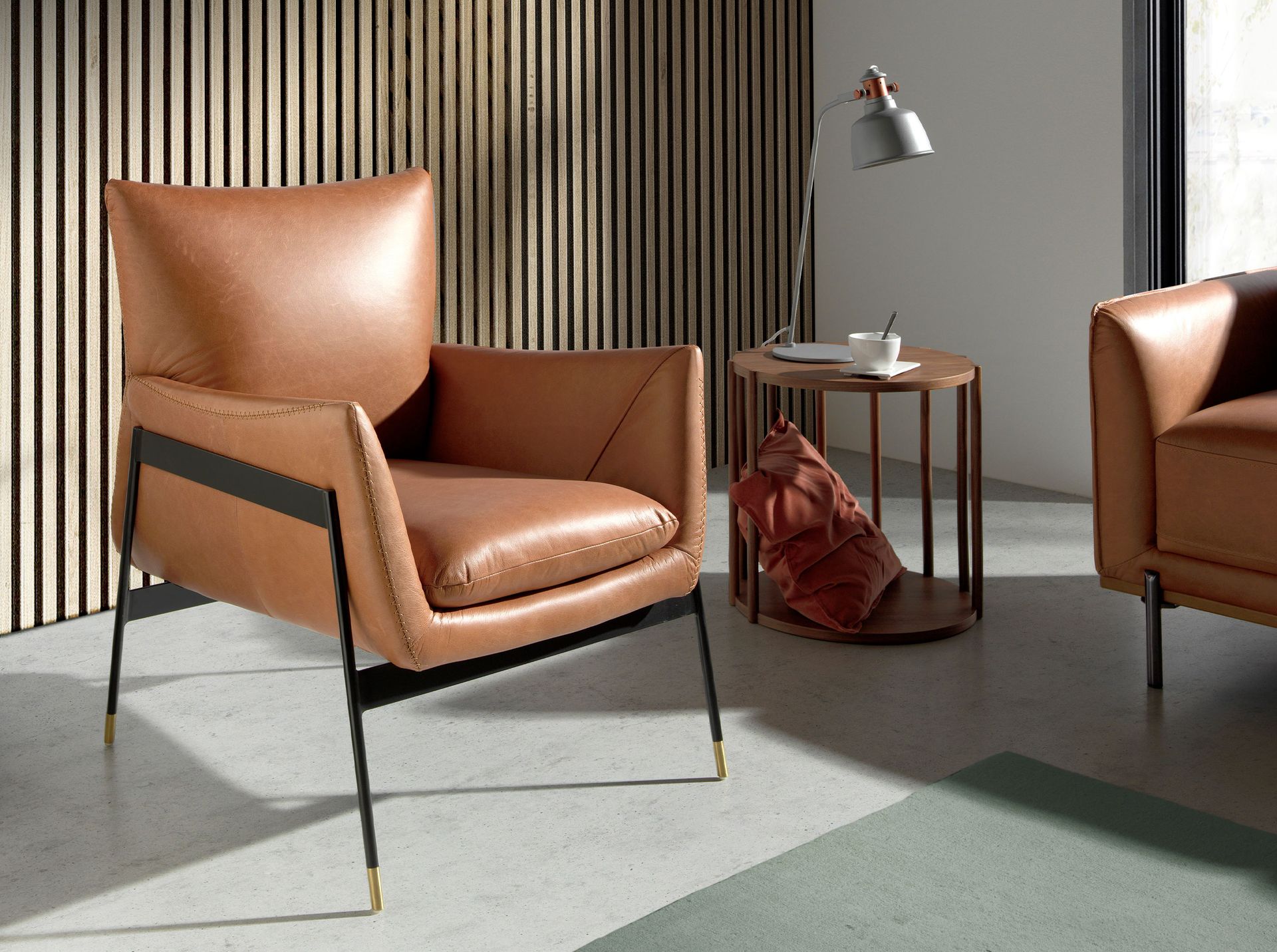 Brown leather swivel armchair