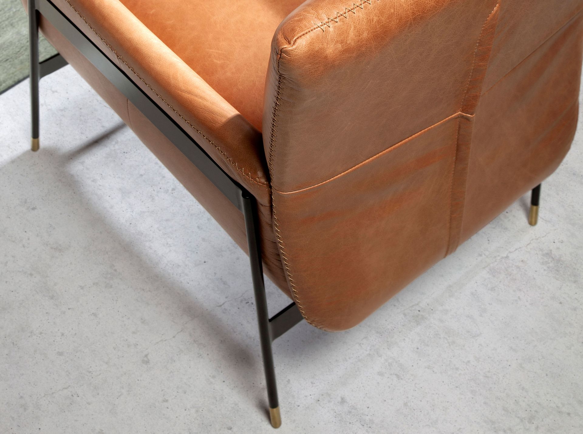 Brown leather swivel armchair