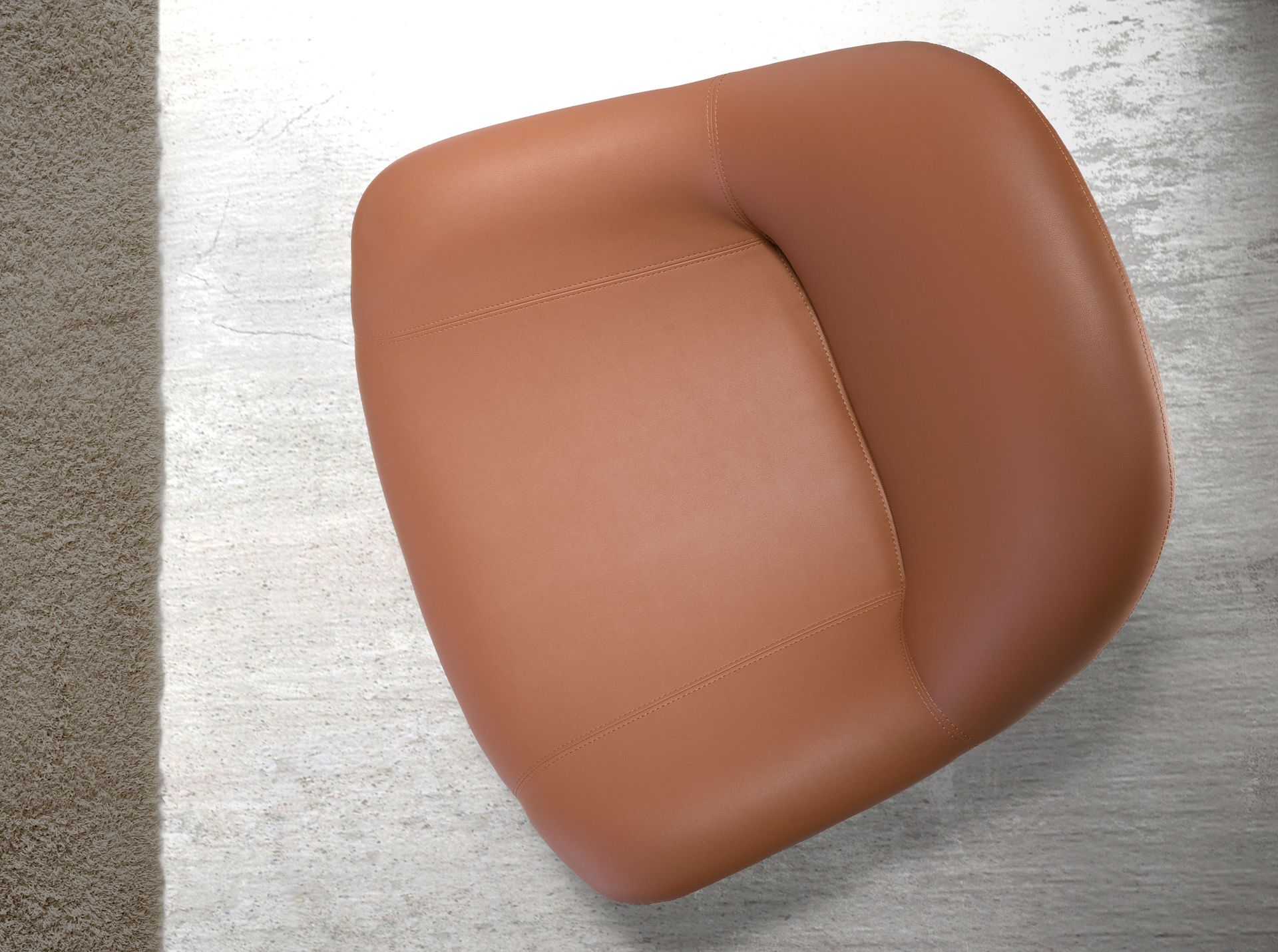 Brown leatherette swivel armchair