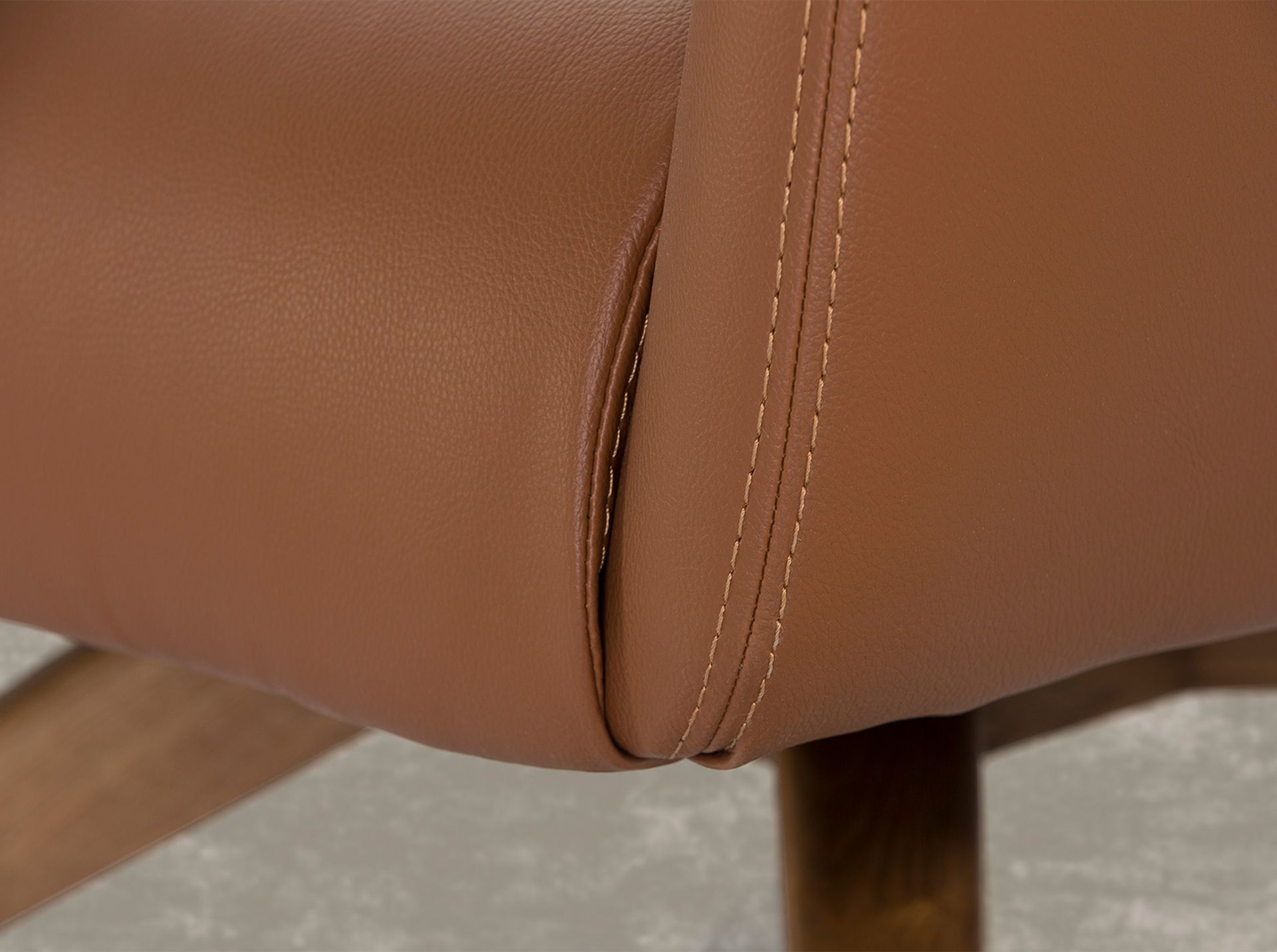 Brown leatherette swivel armchair