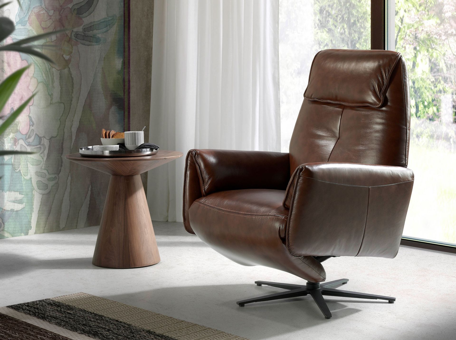 Chocolate brown leather swivel armchair