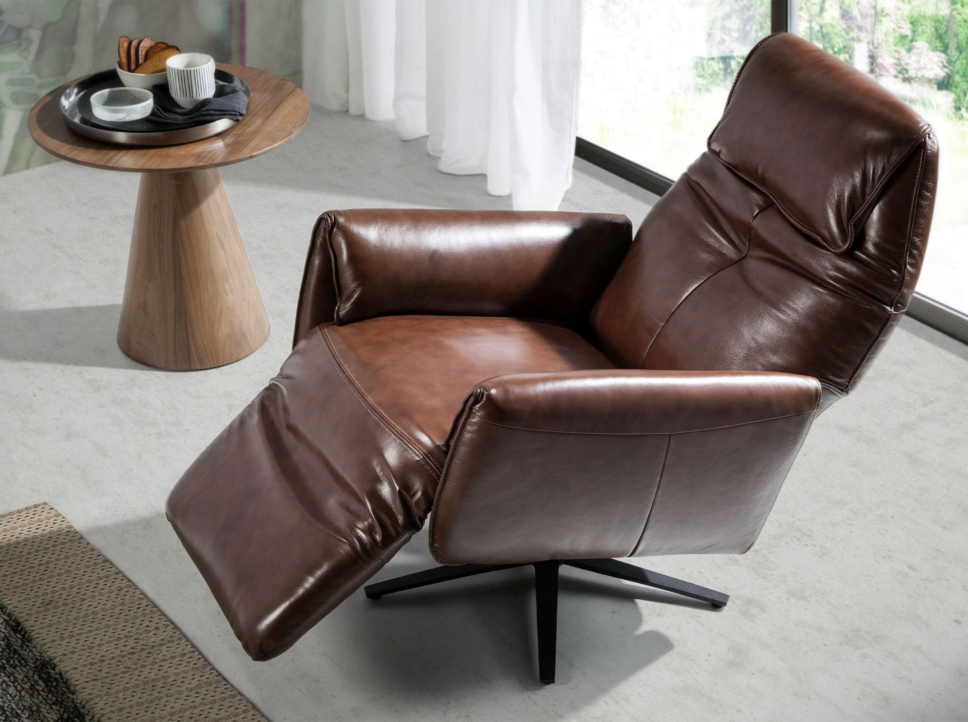 Chocolate brown leather swivel armchair