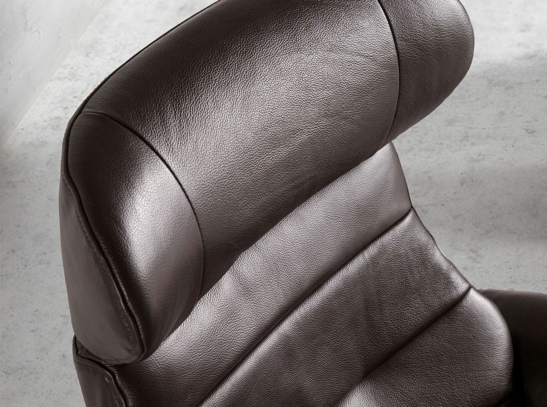 Chocolate brown leather swivel recliner armchair