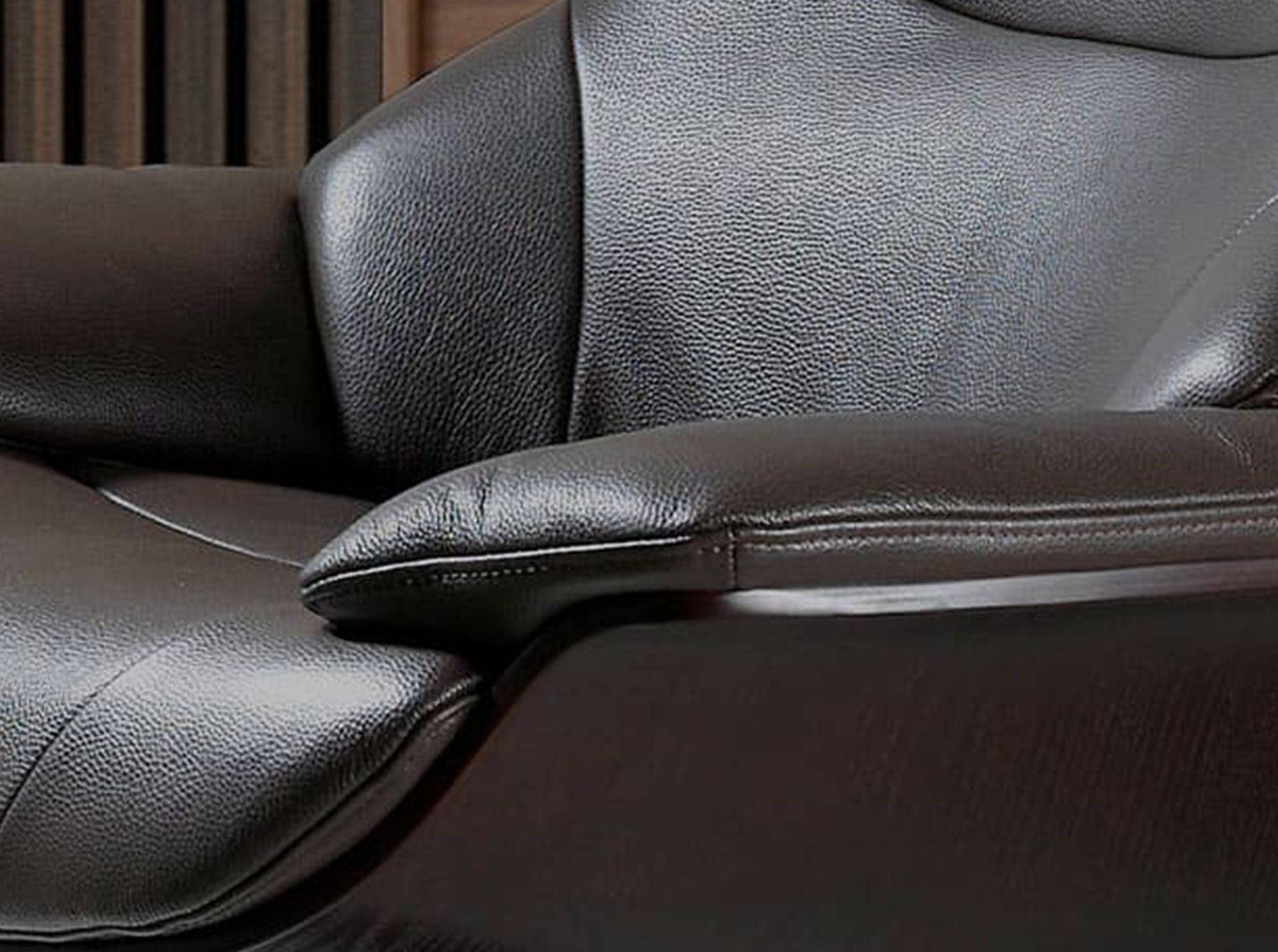 Chocolate brown leather swivel recliner armchair