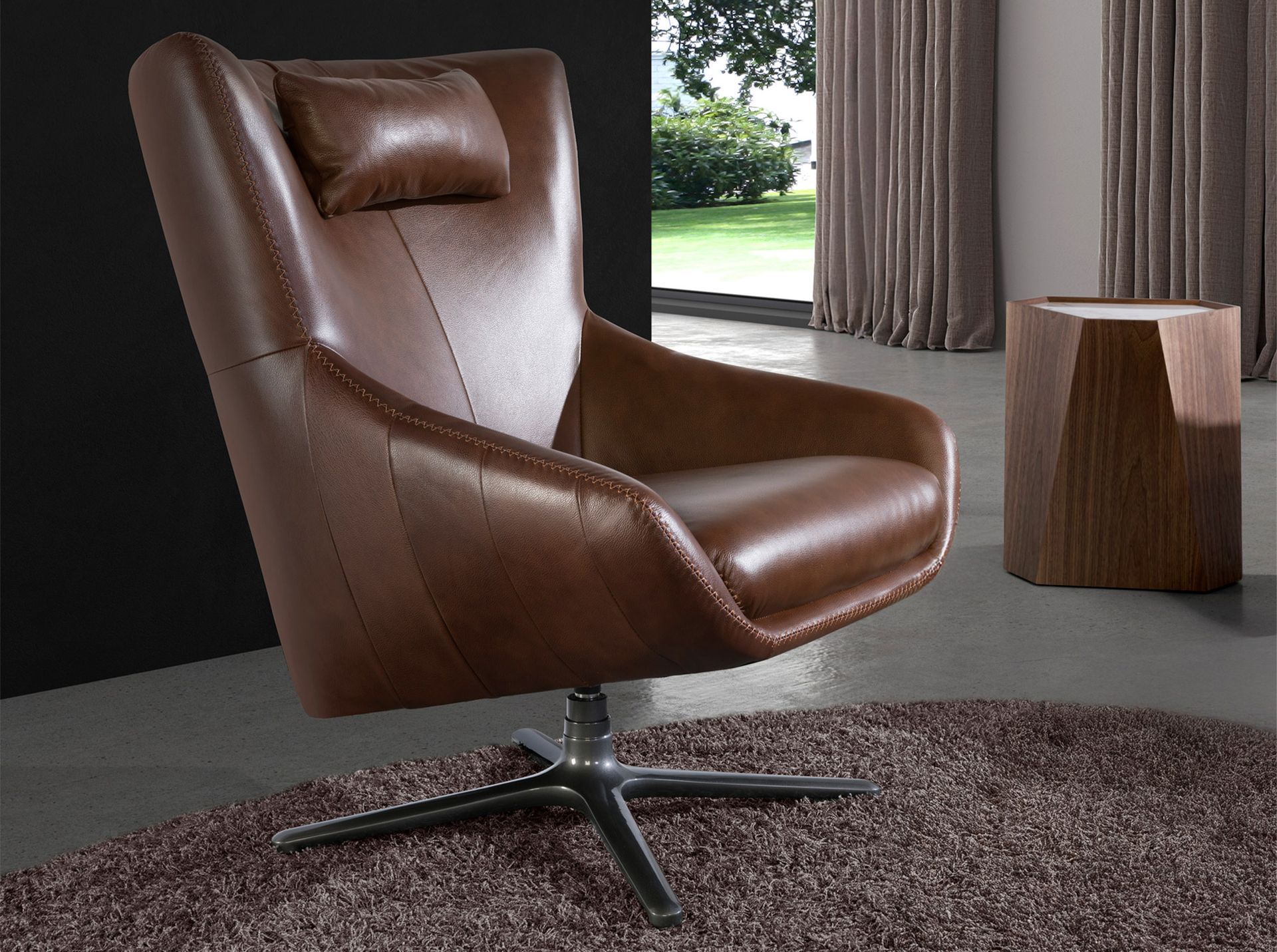 Cognac brown leather swivel armchair