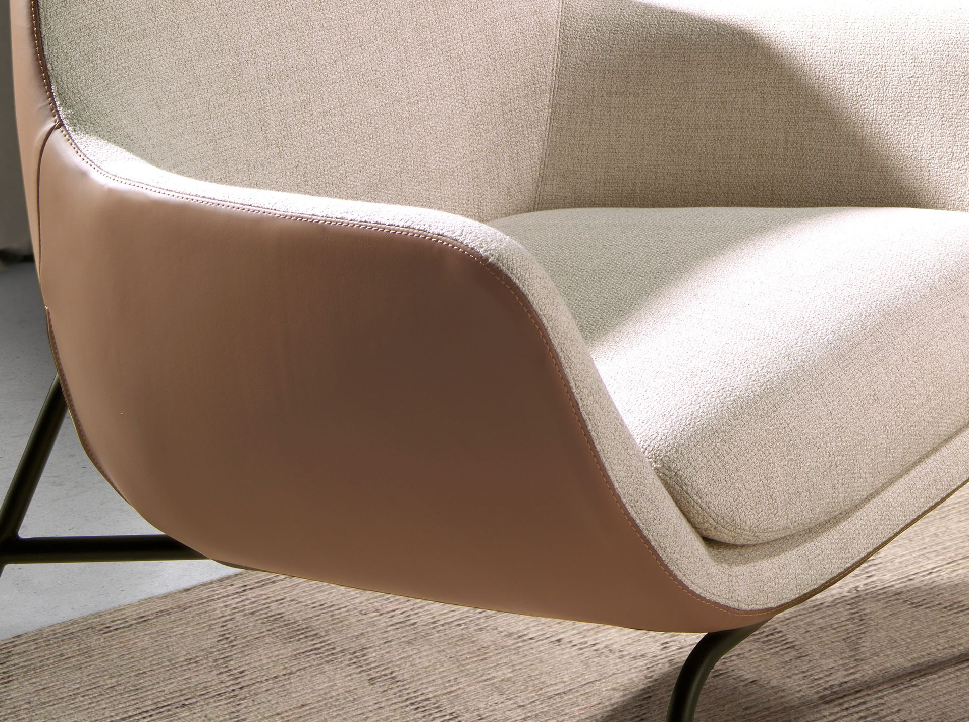 Cream fabric and brown leatherette armchair