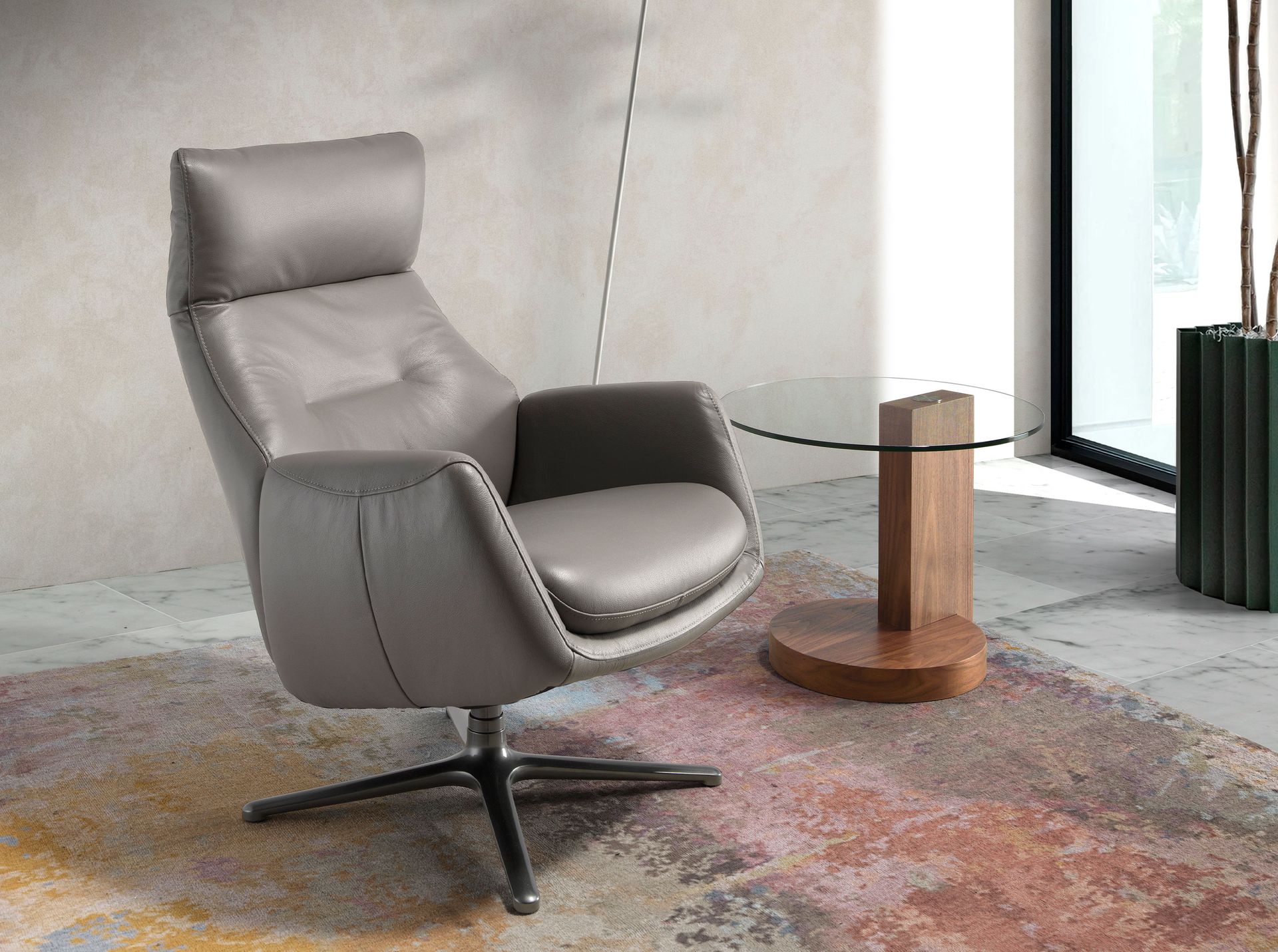 Dark grey leather swivel recliner