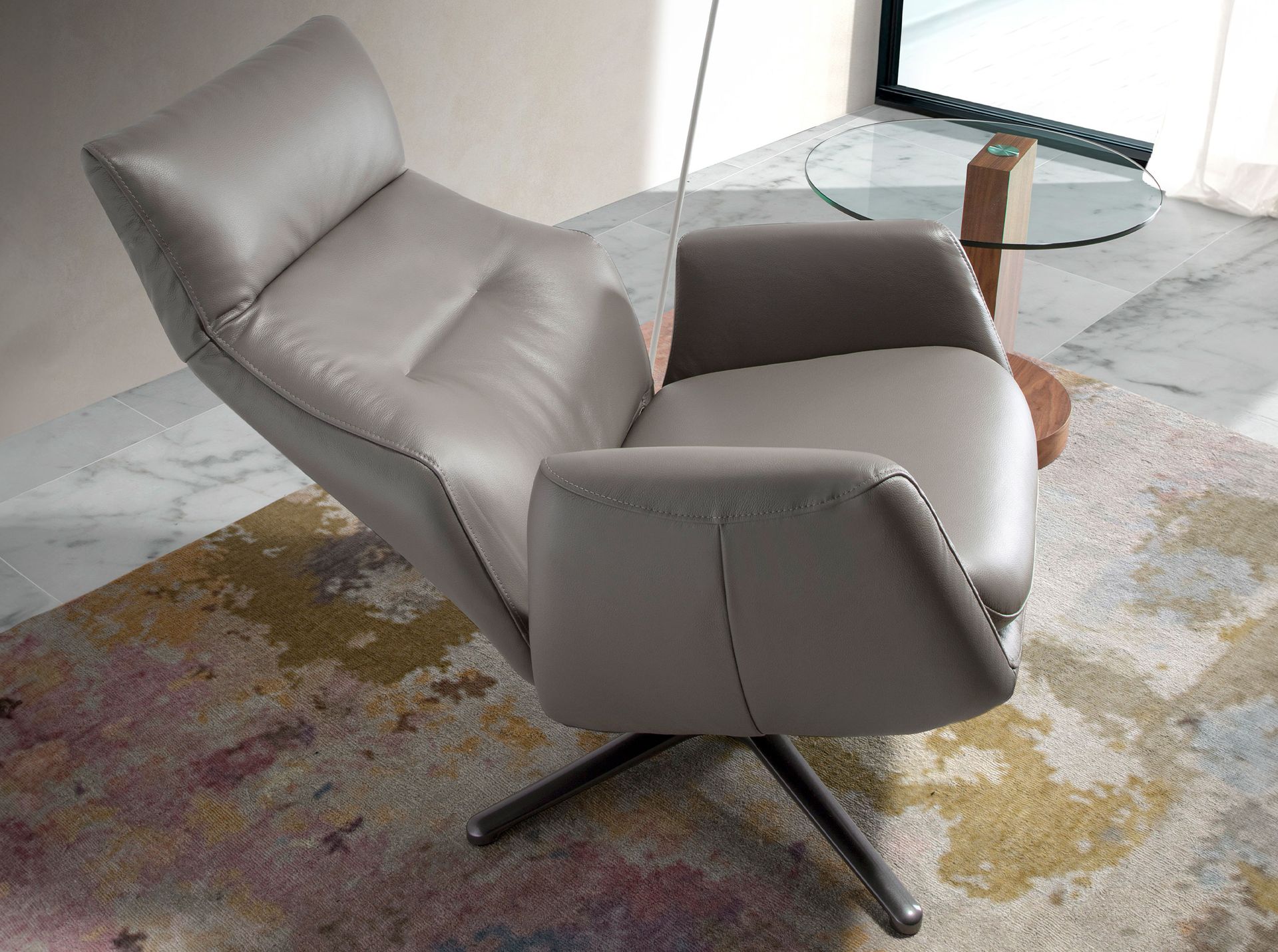 Dark grey leather swivel recliner