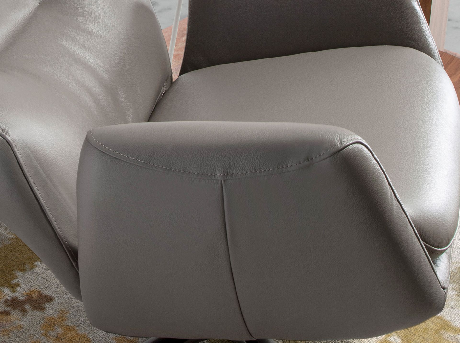 Dark grey leather swivel recliner