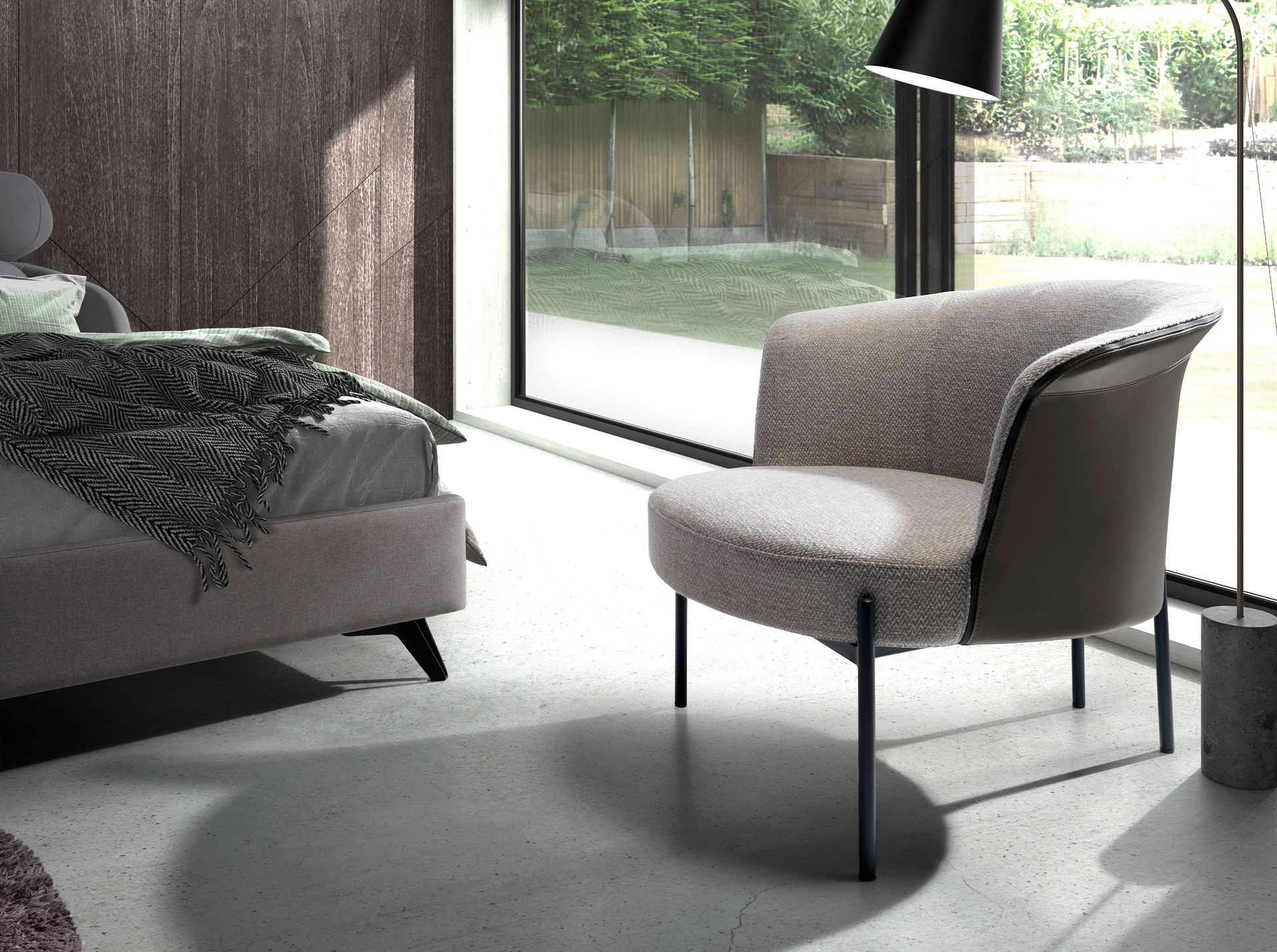 Grey fabric and dark grey leatherette armchair
