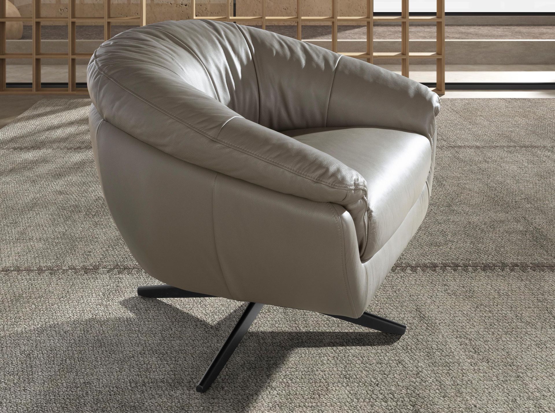 Grey leather swivel armchair