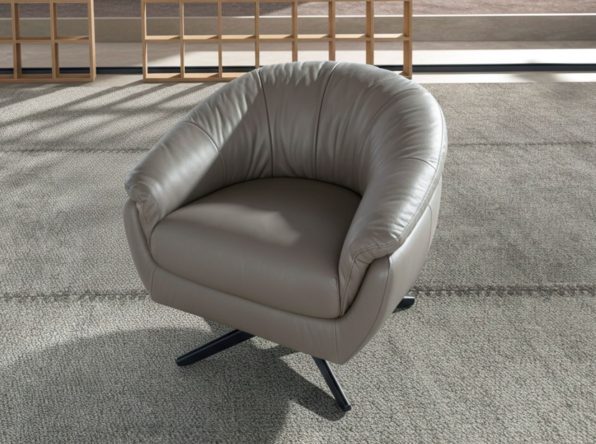 Grey leather swivel armchair