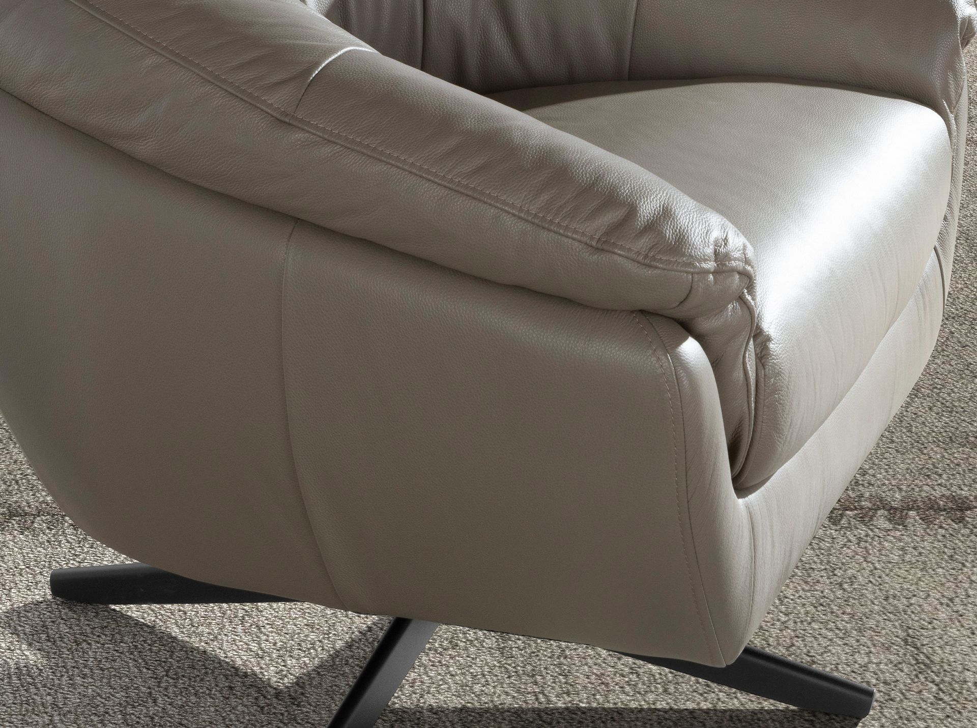 Grey leather swivel armchair