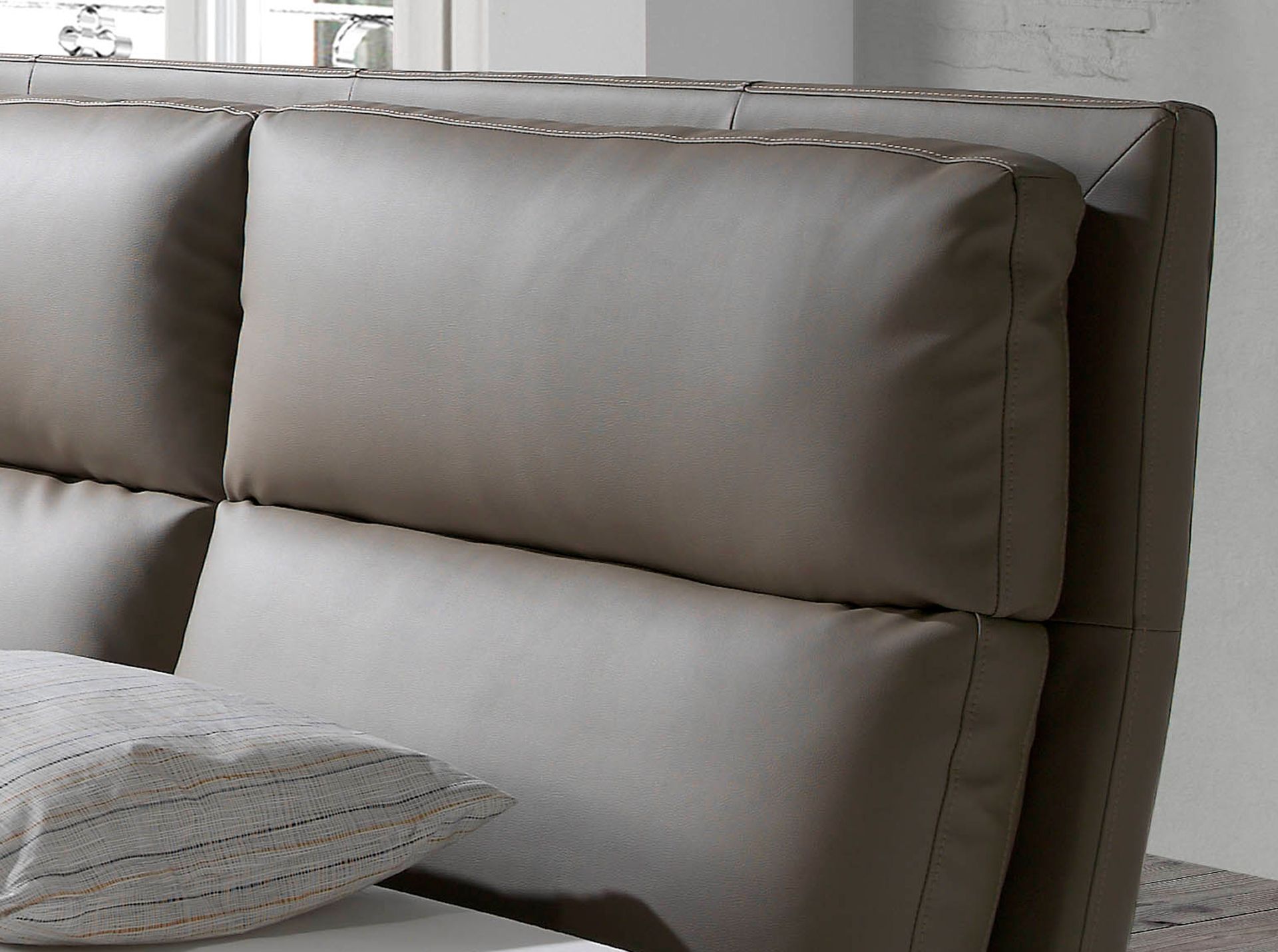 Mink coloured leatherette bed