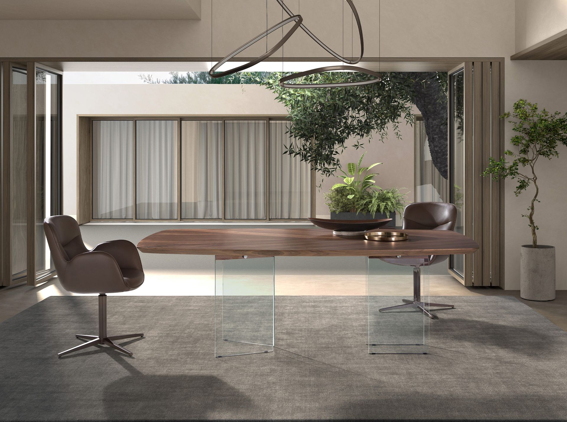 Oval barrel dining table in walnut and tempered glass