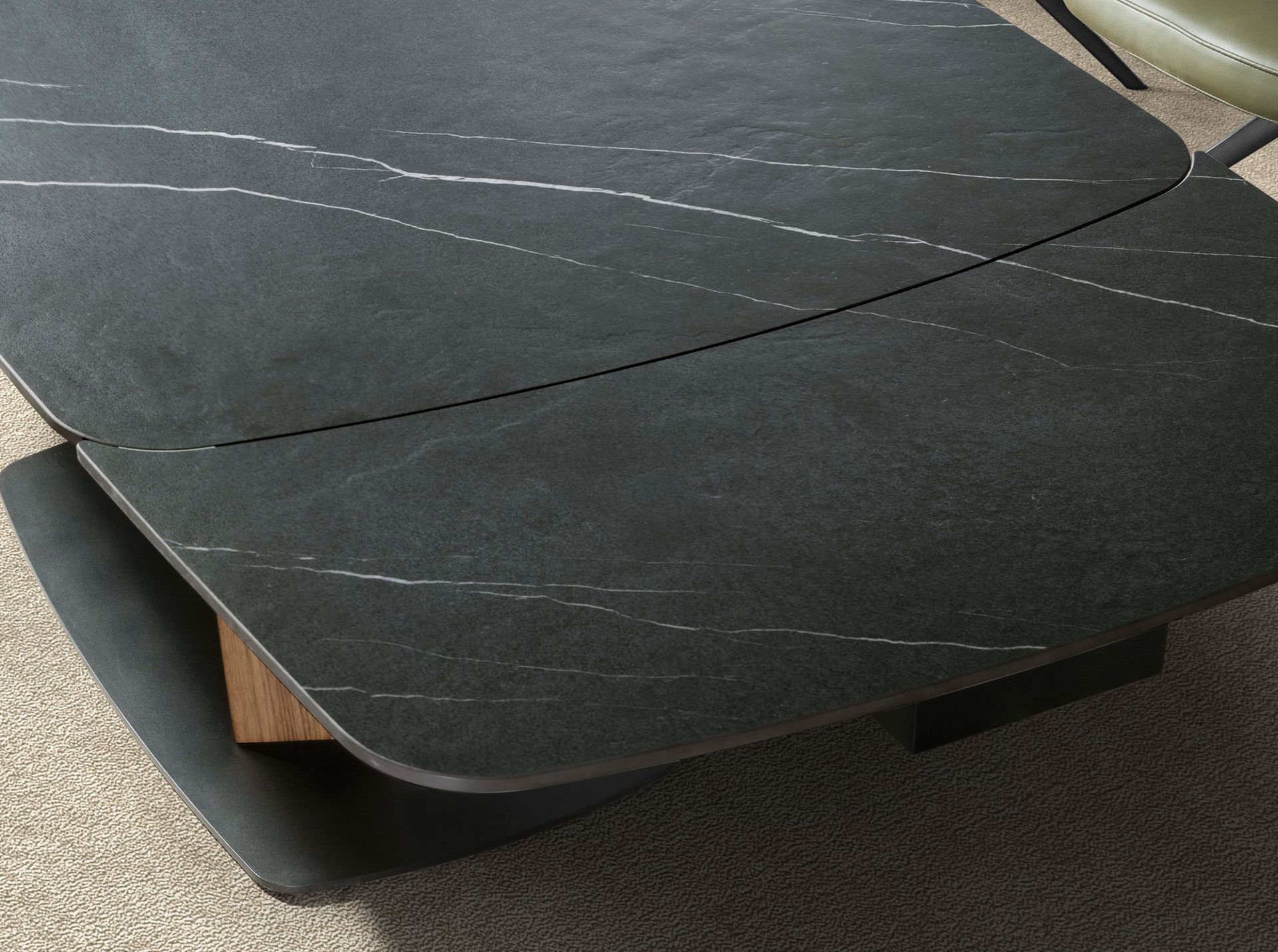 Oval extending dining table with porcelain marble and walnut barrel