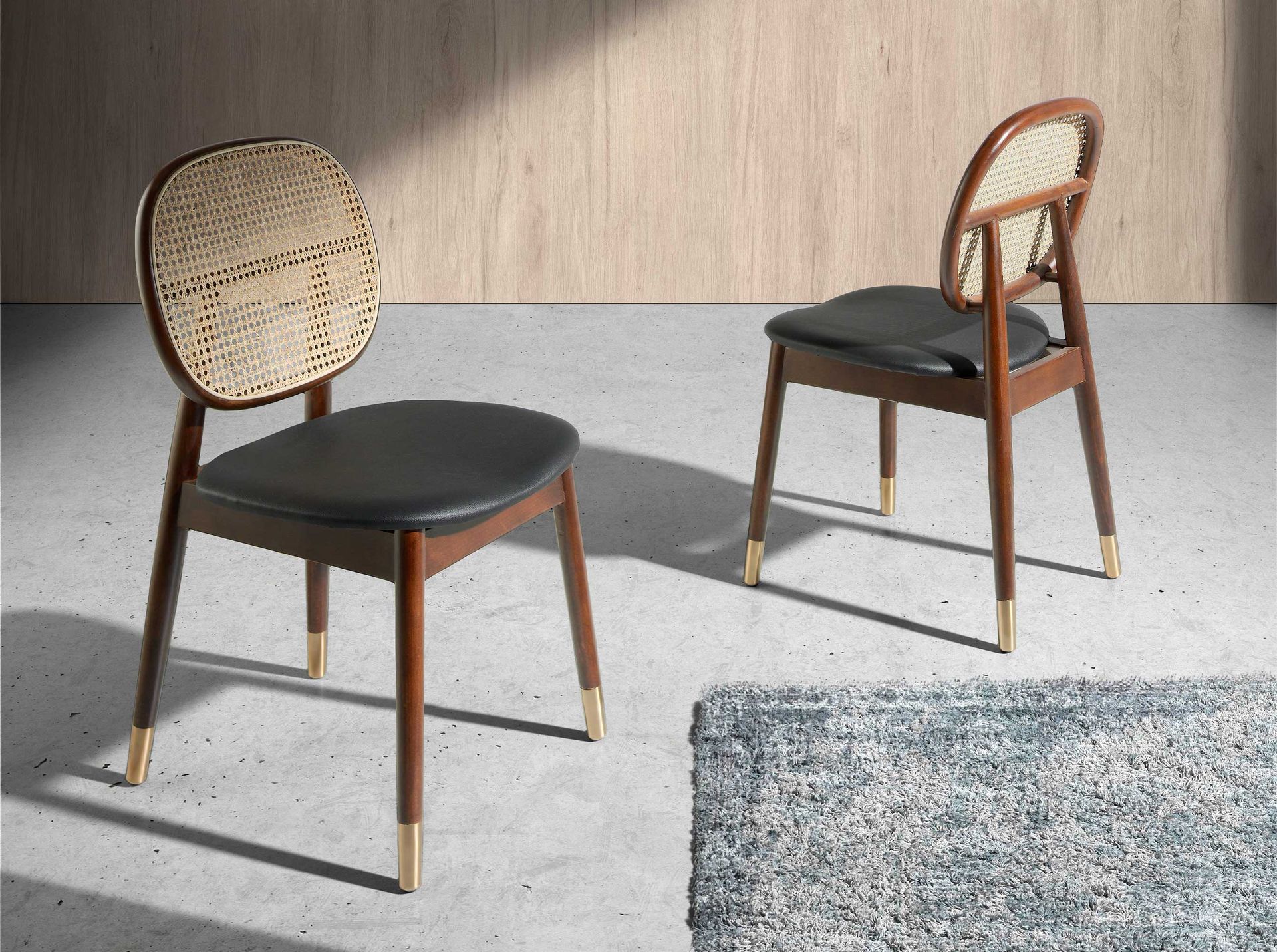 Rattan and black leatherette chair
