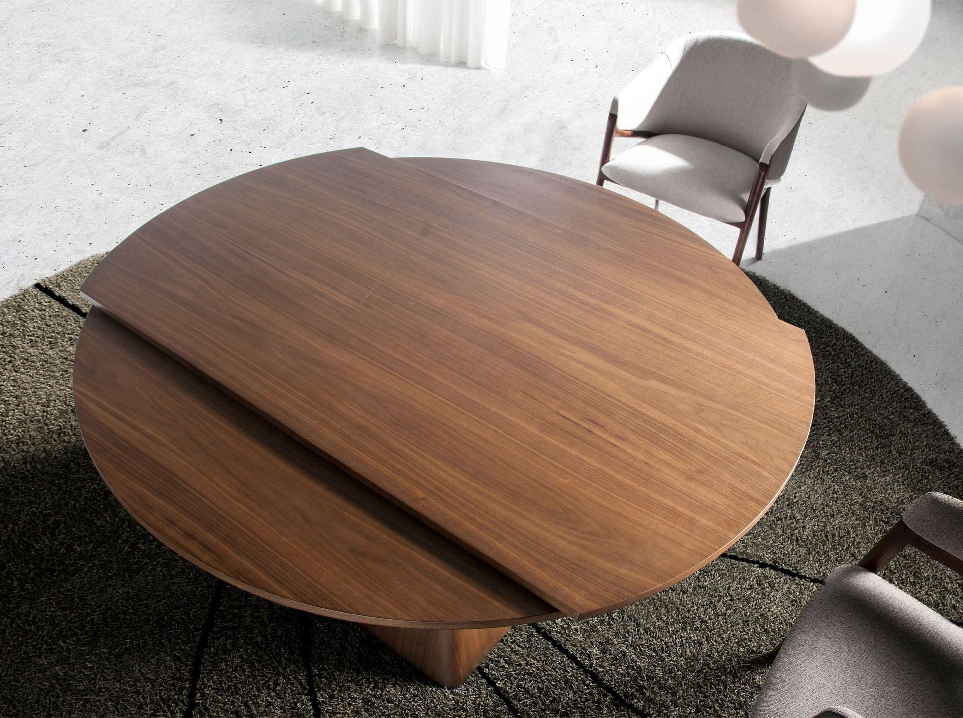 Round walnut extending dining table