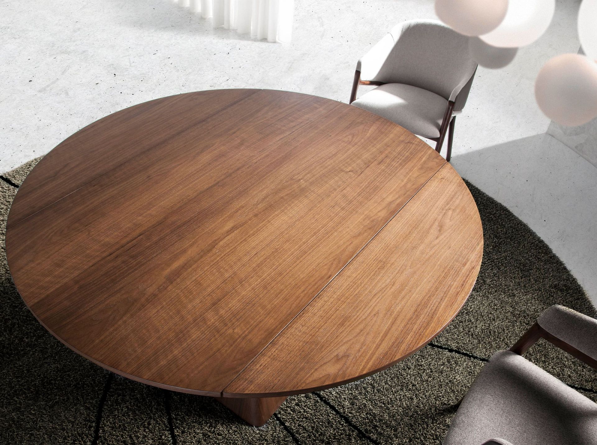 Round walnut extending dining table