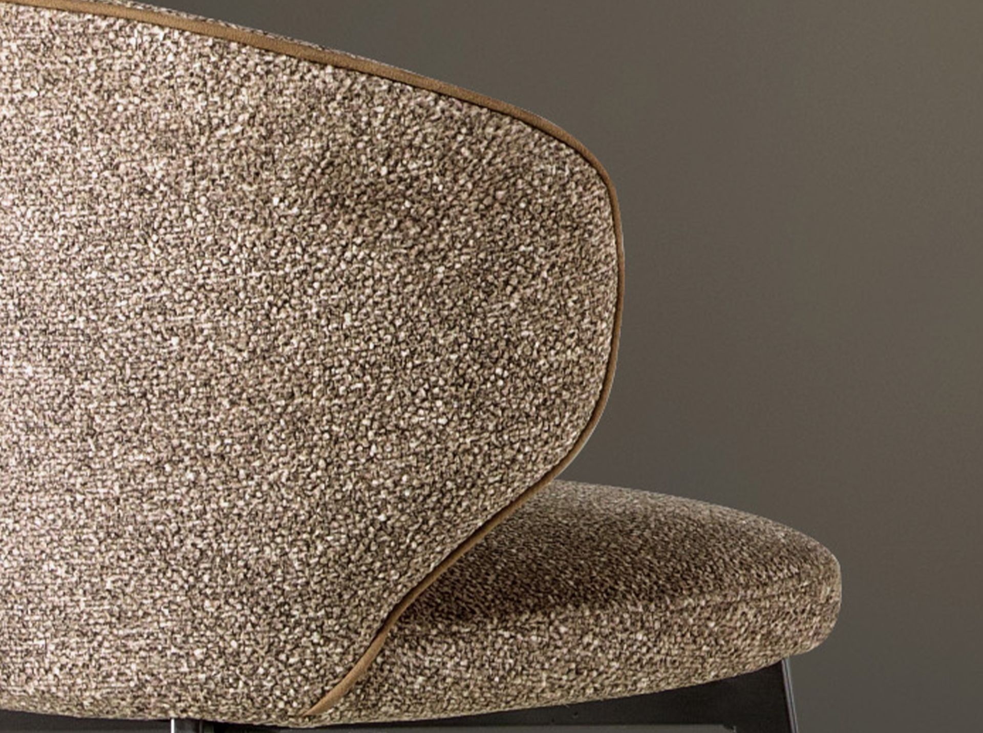 Stool upholstered in mottled brown fabric