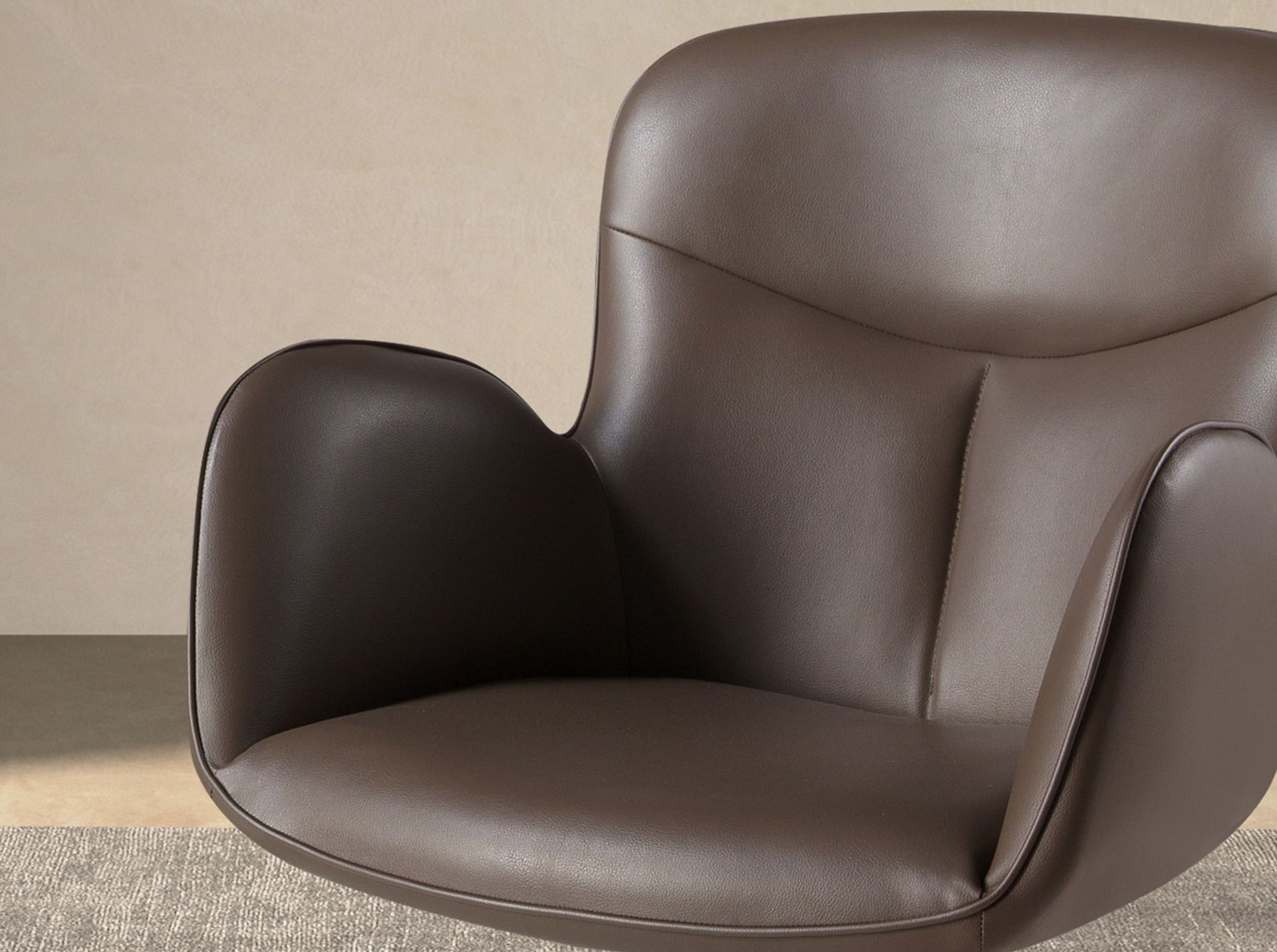 Swivel chair in chocolate brown leatherette