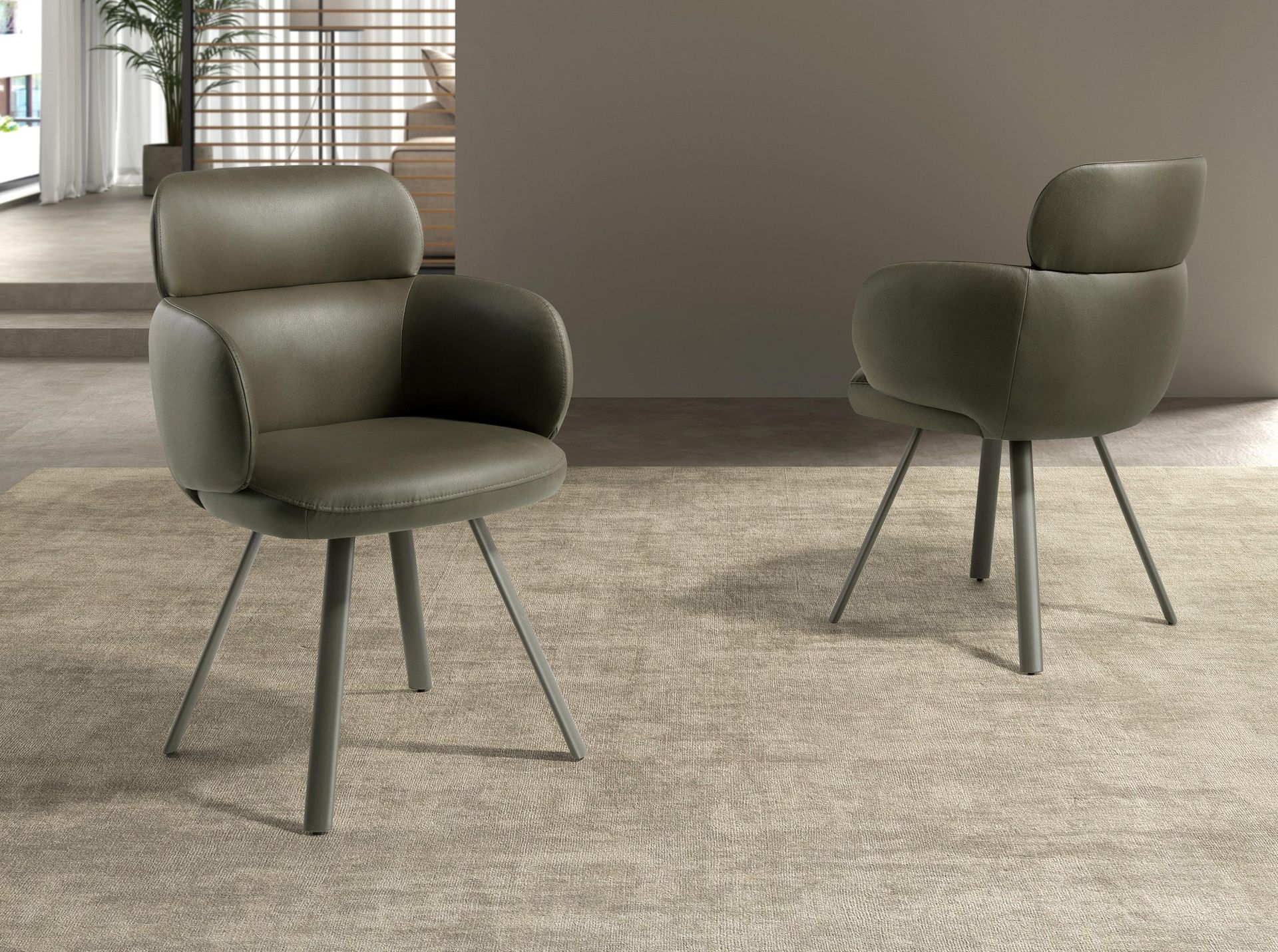 Swivel chair in olive green leatherette