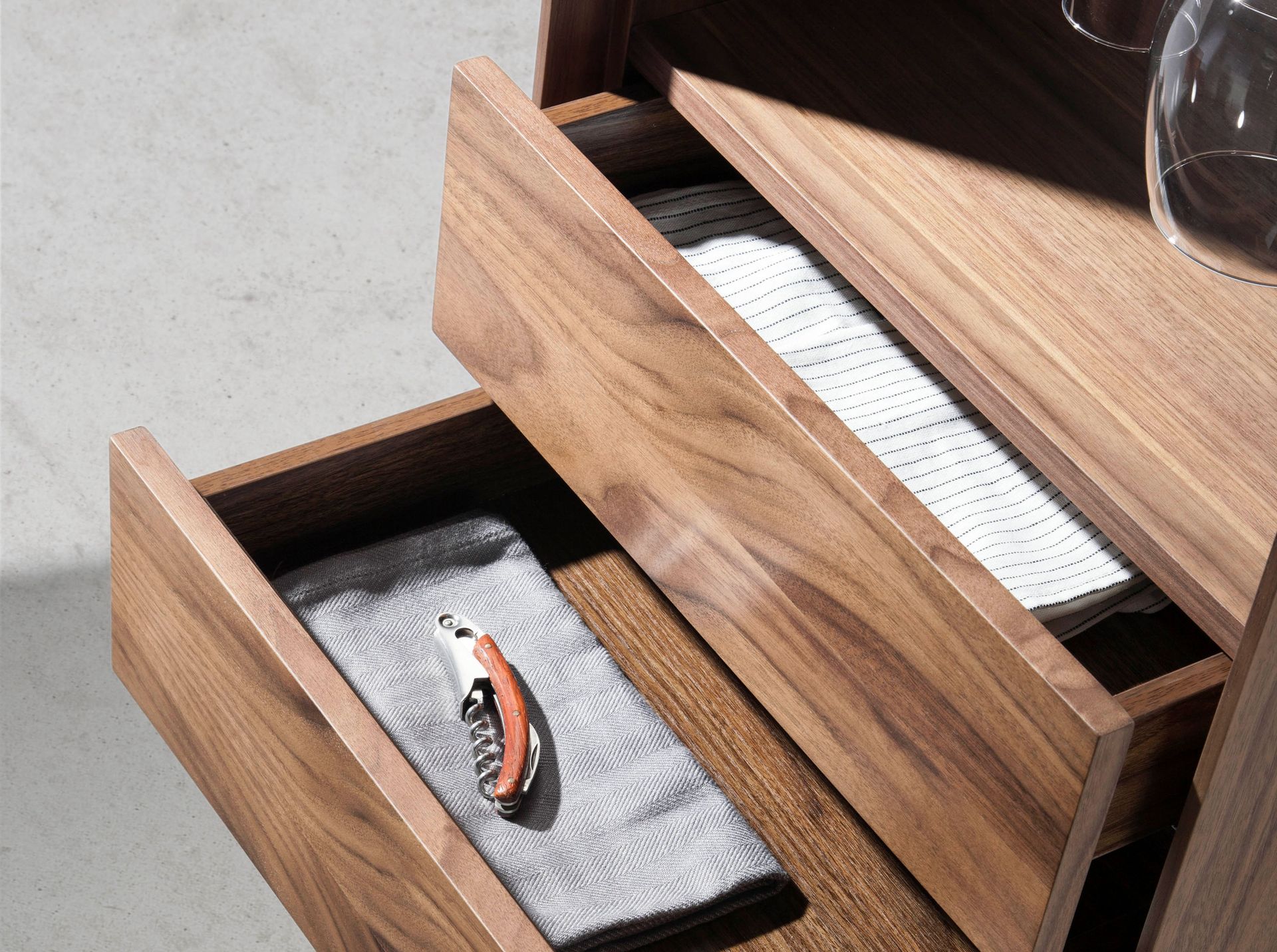 Swivelling walnut bar cabinet