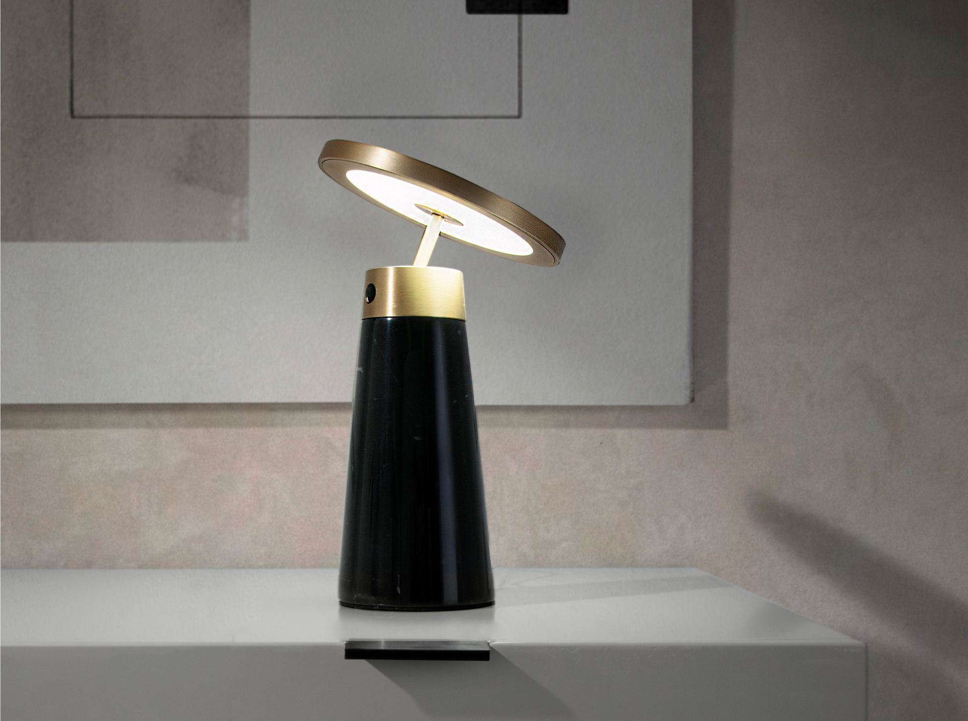 Table lamp in black marble and golden steel