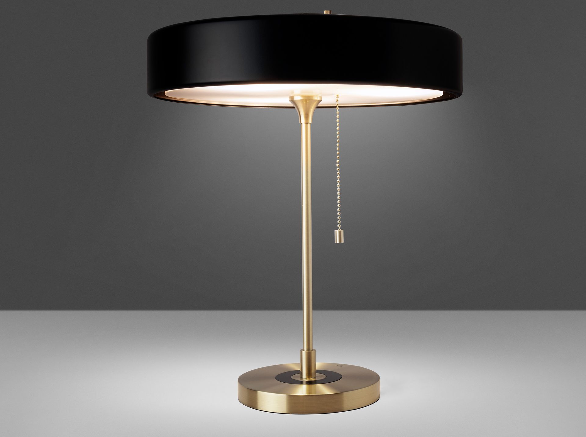 Table lamp in gold aluminium and black aluminium