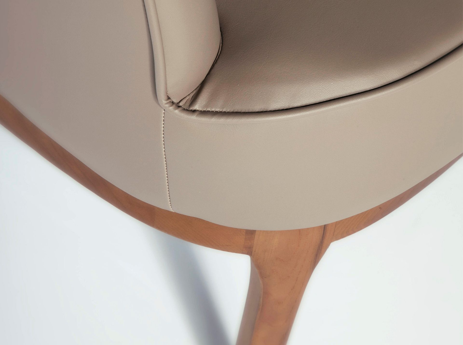 Taupe grey leatherette armchair
