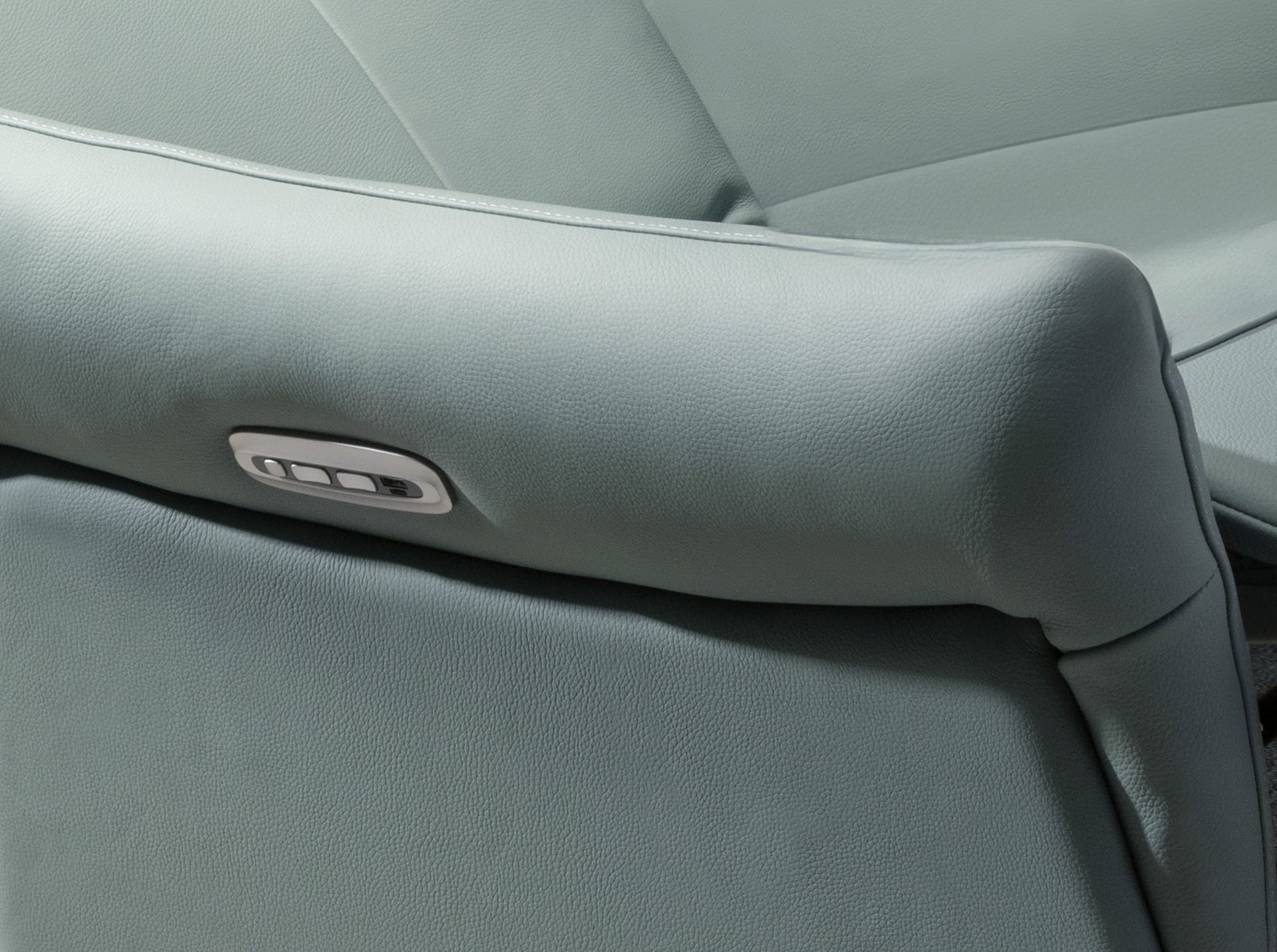 Turquoise green leather swivel relax armchair