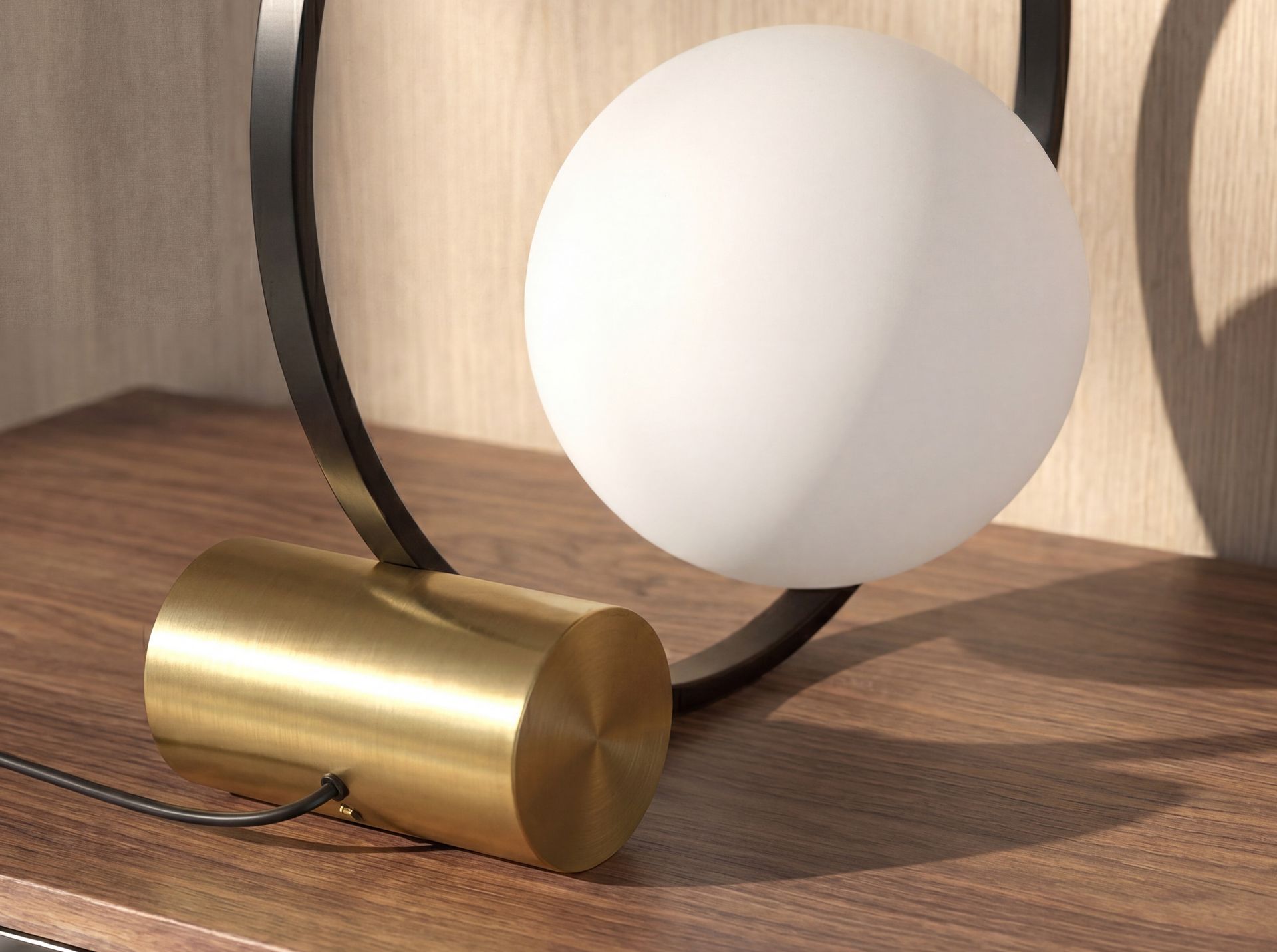 White glass and black steel table lamp with polished gold steel base